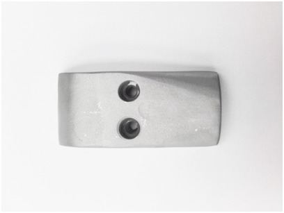 Steel bracket with a clean, even finish after sand blasting